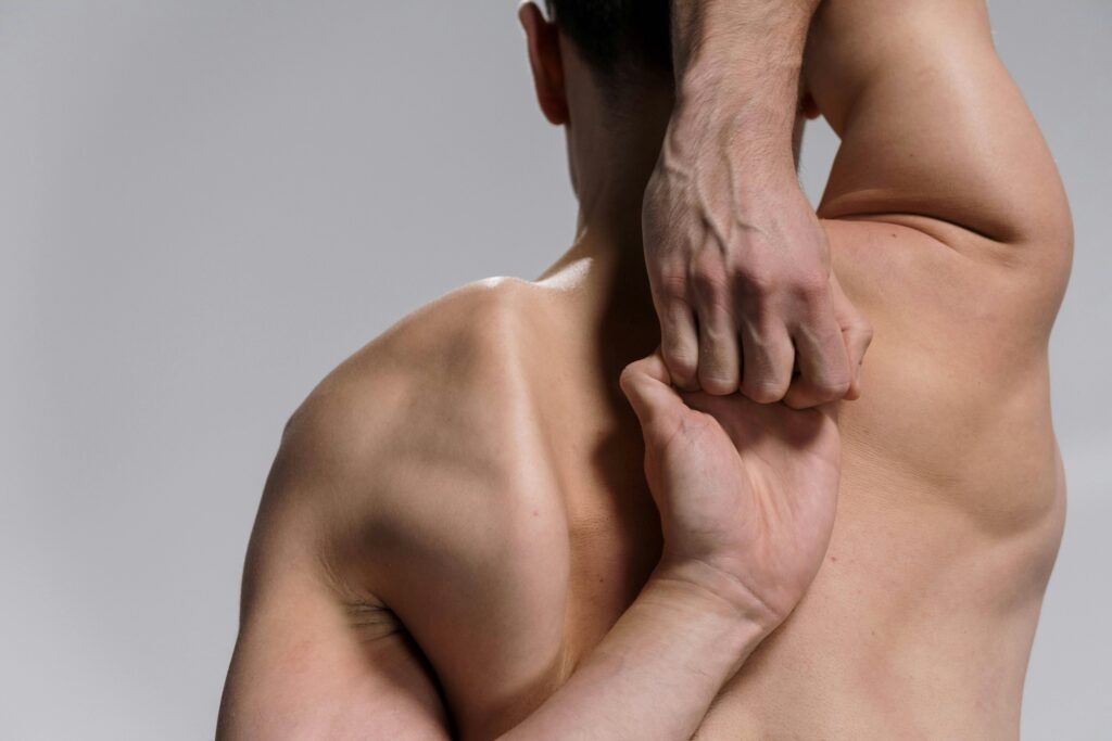 A man correcting his posture with simple exercises