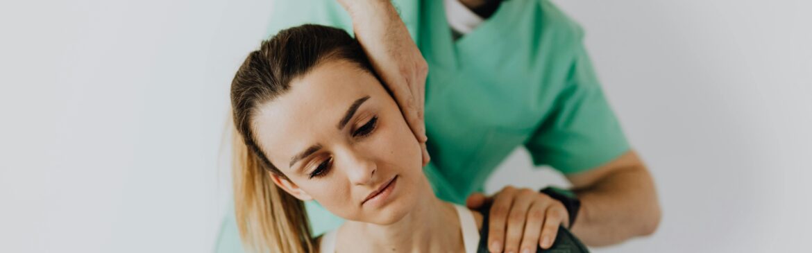 A physiotherapist attending to her neck pain