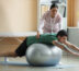 Doctor helping a patient with his balance