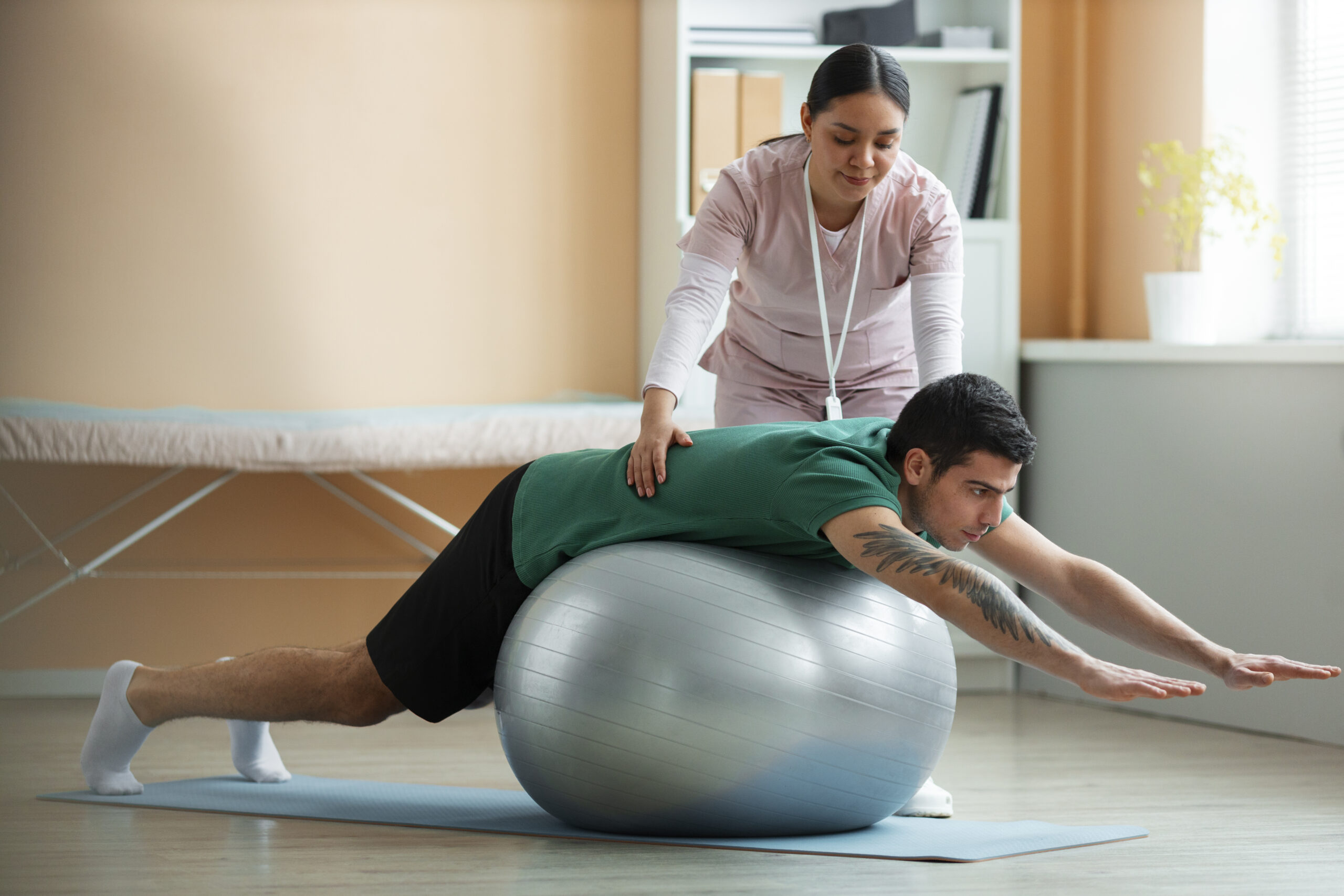 Doctor helping a patient with his balance